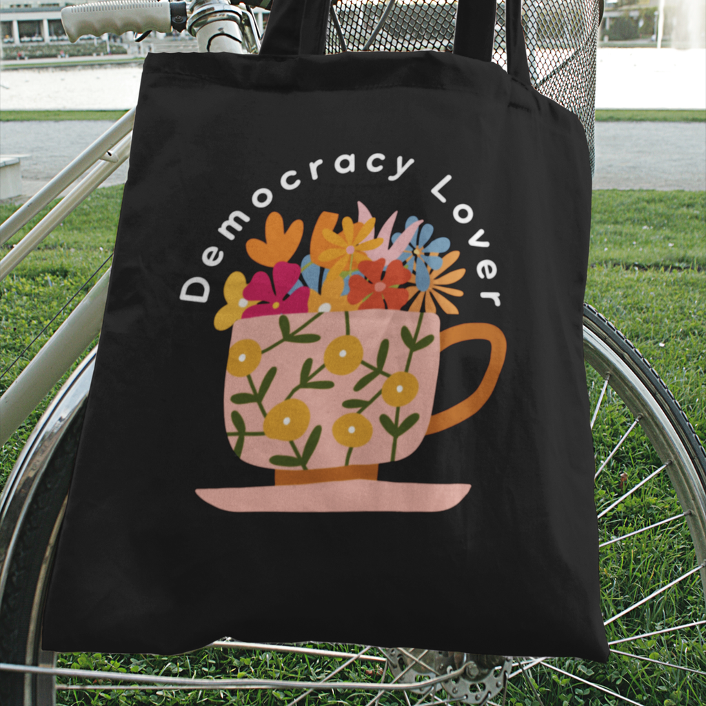 Democracy Lover Black Tote Bag – Floral Mug Political Canvas Tote | Cozy Activism Reusable Bag | Progressive Gift for Democracy Supporters